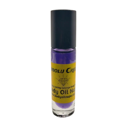 A purple bottle of Absolu Creed body oil with a black cap and a label indicating it is a body oil fragrance.
