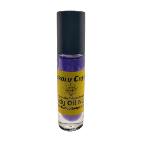 A purple bottle of Absolu Creed body oil with a black cap and a label indicating it is a body oil fragrance.