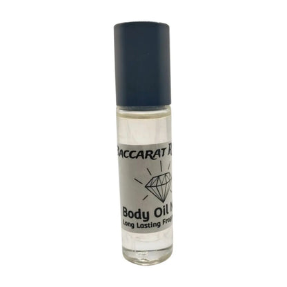 A clear roll-on bottle of Baccarat Rouge body oil with a black cap, labeled with the brand name and the word 'Body Oil'.