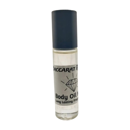 A clear roll-on bottle of Baccarat Rouge body oil with a black cap, labeled with the brand name and the word 'Body Oil'.