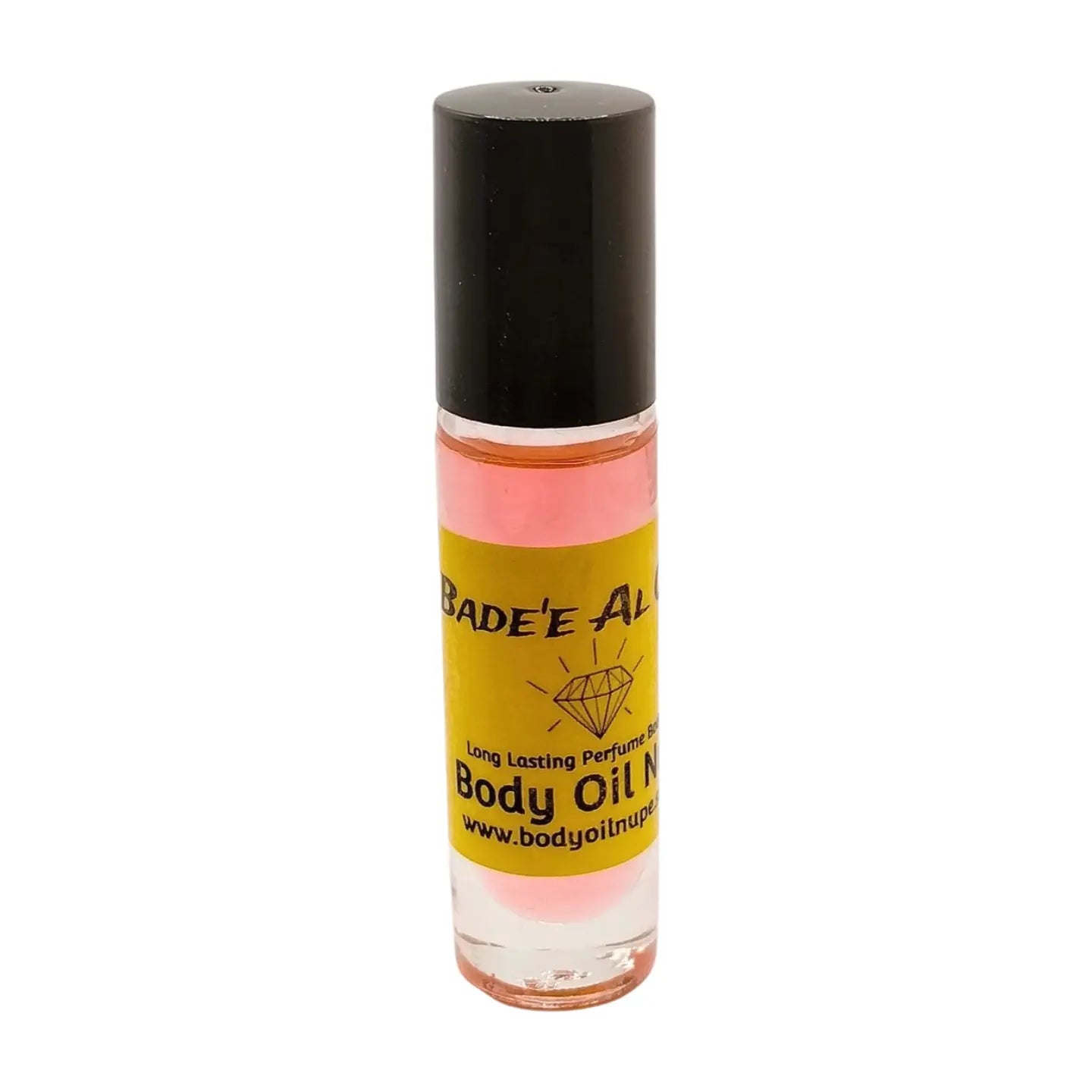 A bottle of Bade'e Al Oud body oil, pink color, with a yellowlabel and black cap, set against a white background.