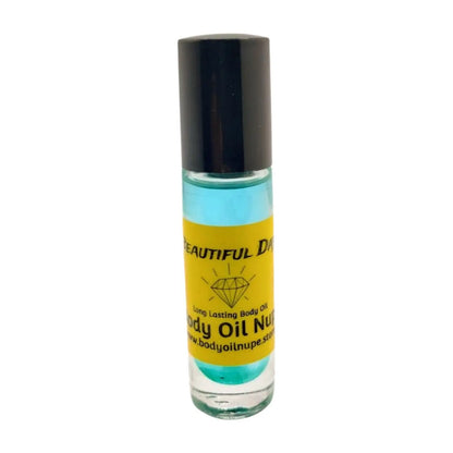 A clear bottle with a black cap containing body oil, labeled 'BEAUTIFUL DAY Long Lasting Body Oil by Nupe', with a yellow and green label. Long-lasting fragrance from Body Oil Nupe