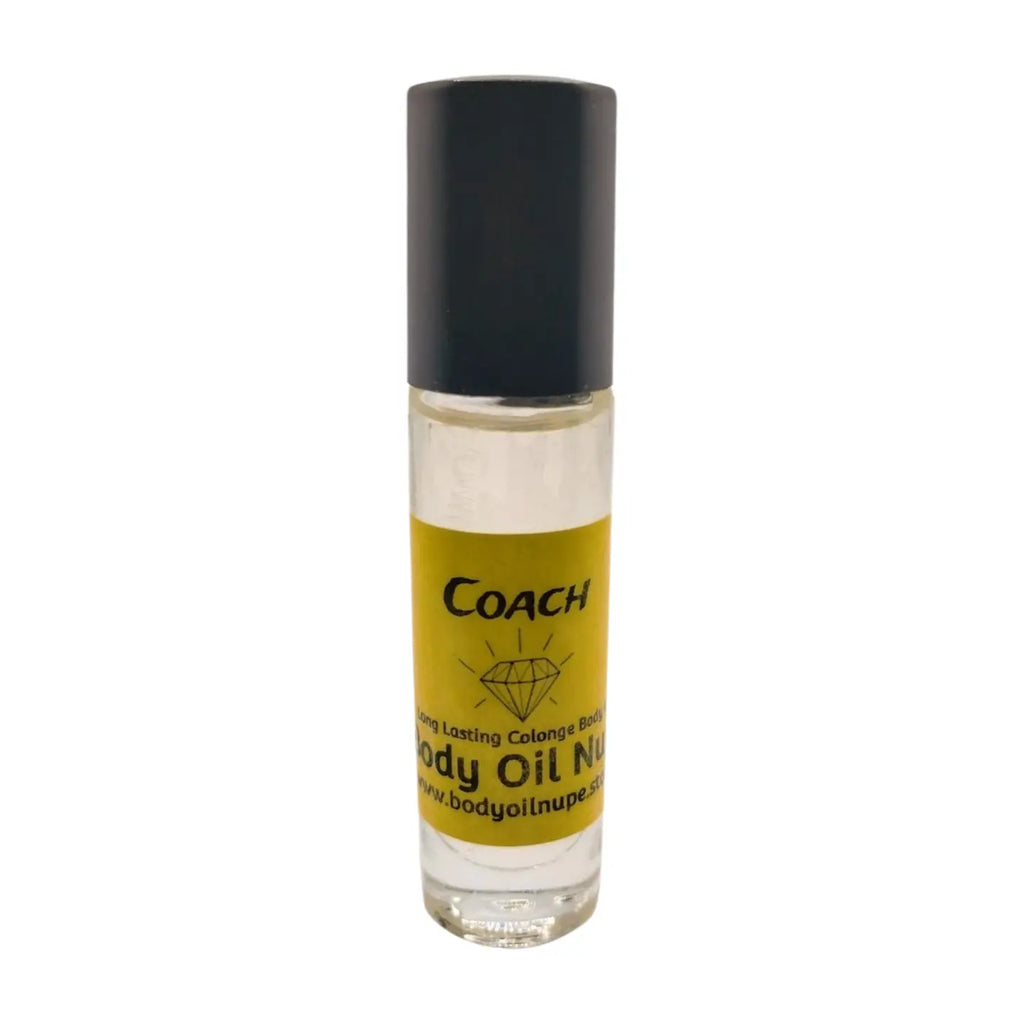 A clear bottle with a black cap labeled 'Coach' containing amber body oil. Long-lasting fragrance from Body Oil Nupe