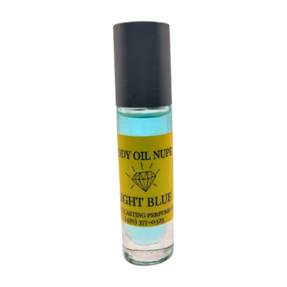 A clear glass bottle with a black cap containing light blue liquid, labeled as 'Body Oil Nupe Light Blue'. Long-lasting fragrance from Body Oil Nupe