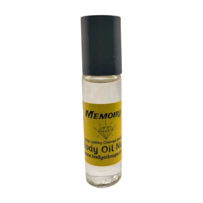A clear bottle of Memoire body oil with a black cap and a yellow label, displayed against a white background. Yellow clear scent inside of glass bottle 