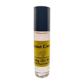 A bottle of Prada Candy Women's Fragrance Body Oil with a clear liquid visible inside, sealed with a black cap and labeled with the product name and brand.