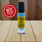 Blue body oil fragrance with yellow label and black cap. Best Seller label