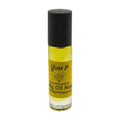 Yellow body oil bottle with black cap on a white background