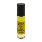 Yellow body oil bottle with black cap on a white background